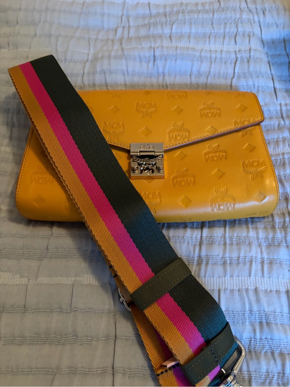 MCM Embossed Leather Envelope Clutch in Mustard